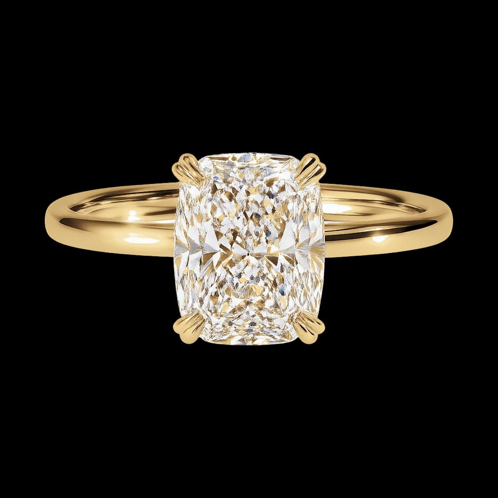 Yellow gold cushion solitaire ring