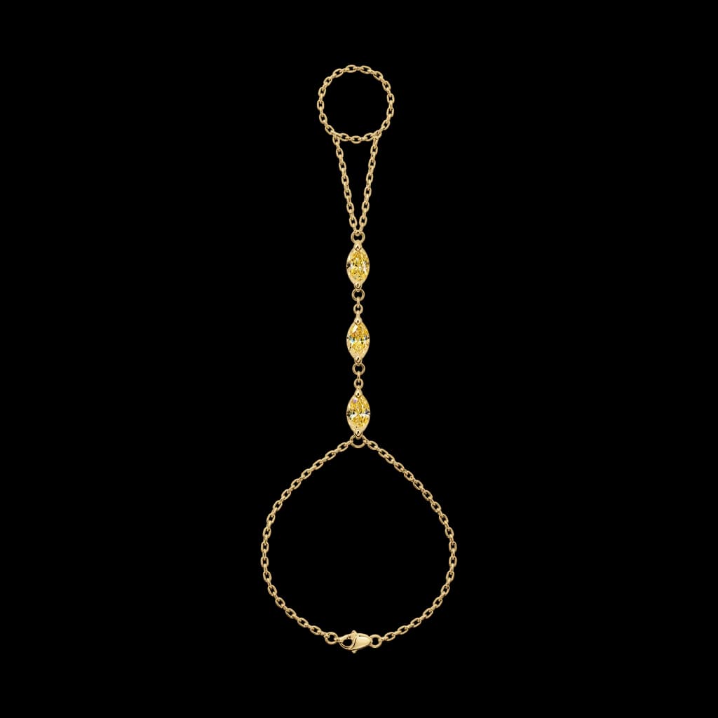 Gold hand chain with stones